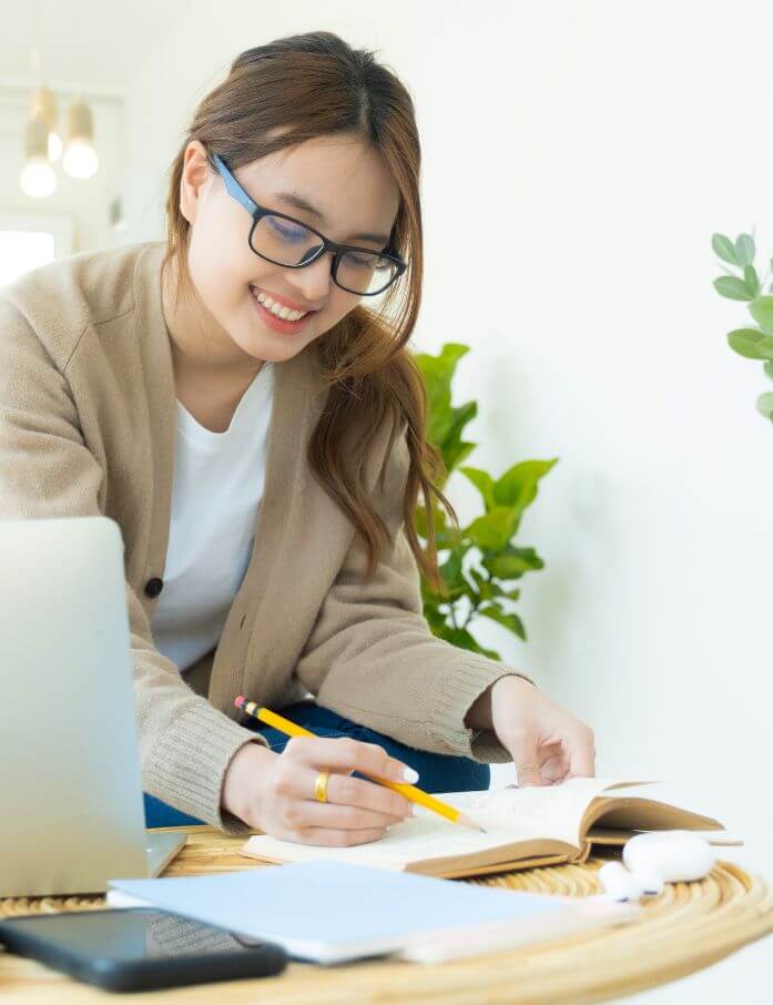 a counsellor writing notes in a book