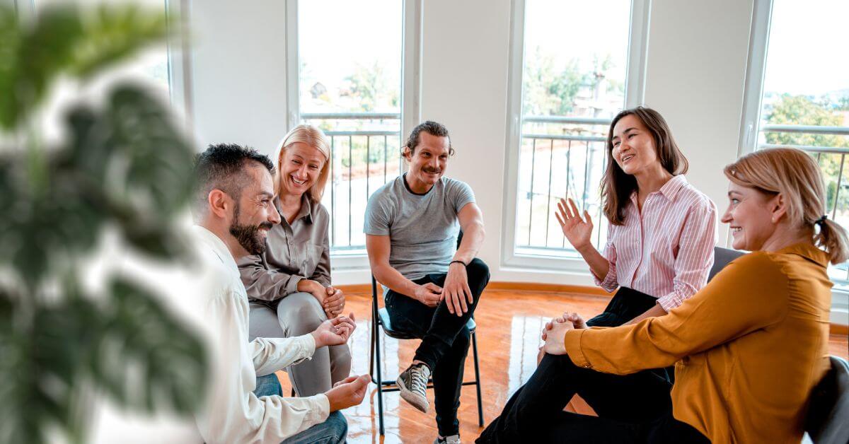 a group of cousellors sitting in chairs